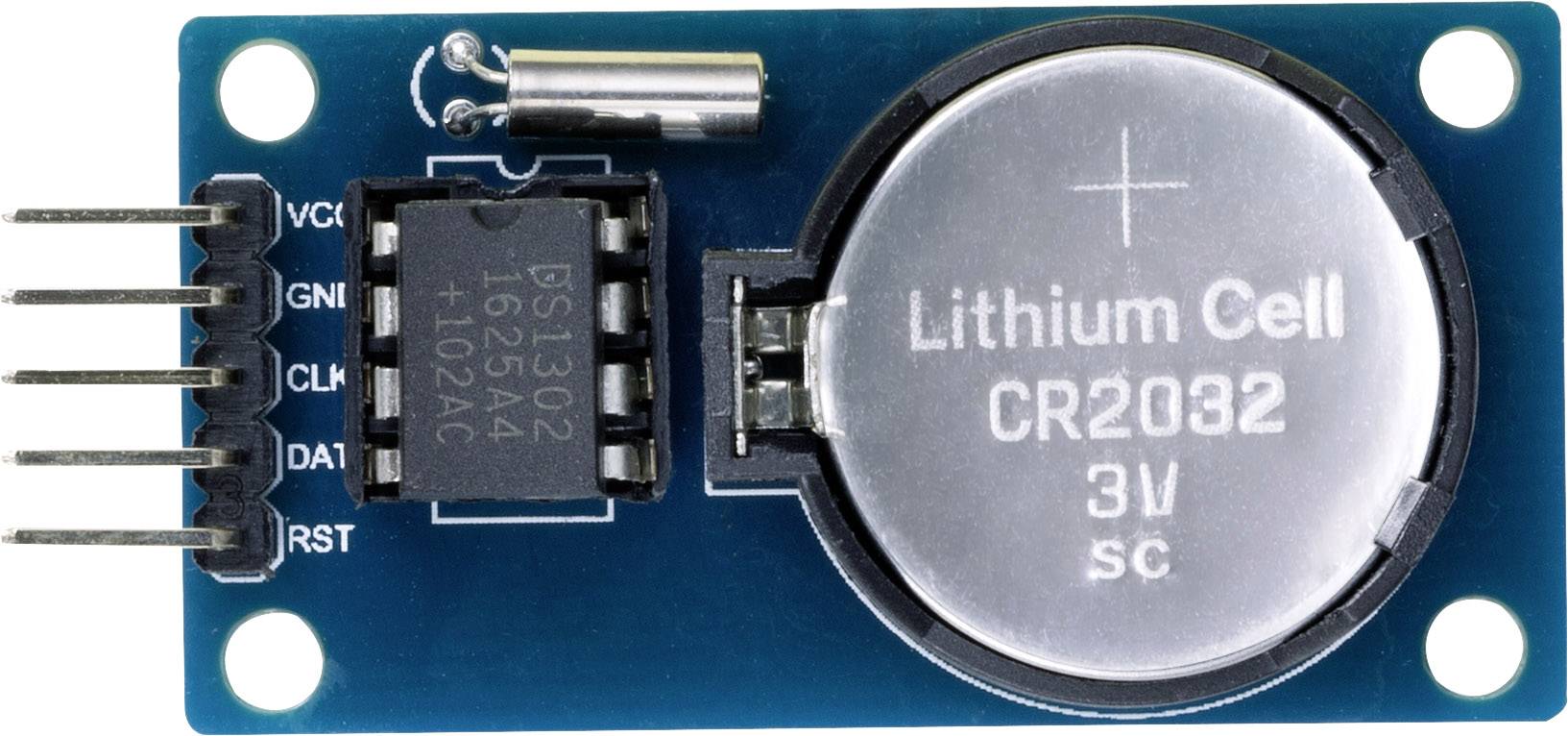 Moduł elektroniczny z baterią guzikową CR2032 i wieloma złączami na płytce drukowanej.
