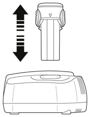 Ilustracja urządzenia z wymienną częścią bateryjną oraz strzałką wskazującą wkładanie lub wyjmowanie tej części.