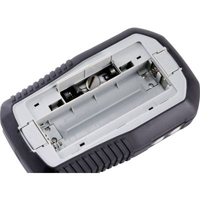 Pokrywa komory baterii elektronicznego urządzenia jest otwarta, ukazując cztery widoczne miejsca na baterie.