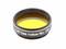 Okrągły, żółty filtr teleskopowy z napisem '1,25" Ciemny Żółty Nr 15'.
