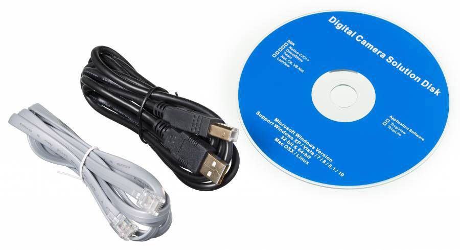 Niebieska płyta CD z napisem 'Digital Camera Solution Disk' obok czarnego i szarego kabla.