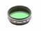 Zielony filtr teleskopowy z napisem '1.25" Green No. 56', przeznaczony do zwiększania kontrastu podczas obserwacji planet.