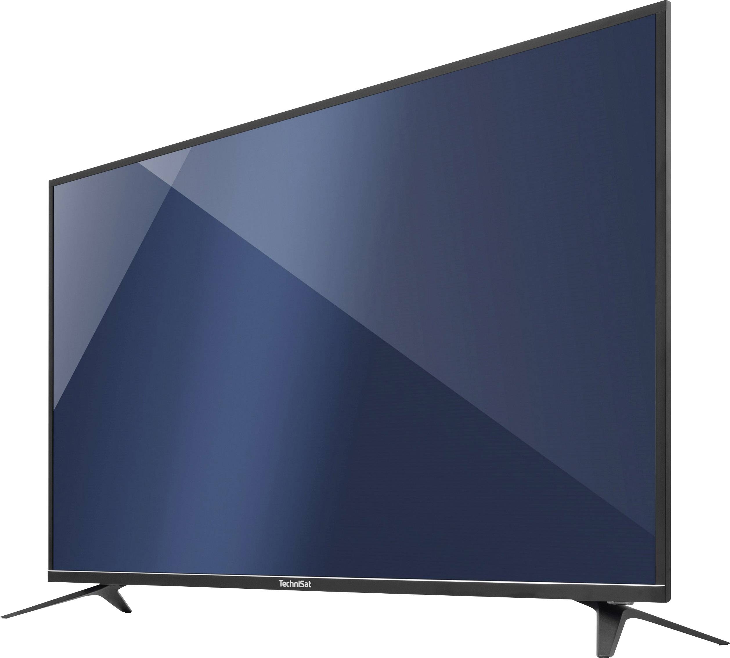 Telewizor plazmowy lub LCD z dużym ekranem, stojący na czarnych podstawkach, włączony z ciemnoniebieskim tłem.