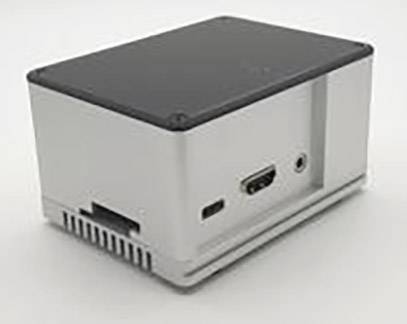 Prostokątne, szare urządzenie elektroniczne z przyłączami po jednej ze stron. Prawdopodobnie mini-komputer lub adapter.