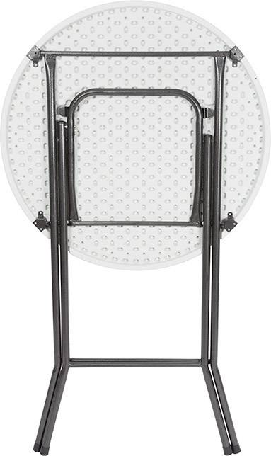 Okrągły, składany stolik metalowy z białym blatem, pokazany w złożonej, pionowej pozycji.