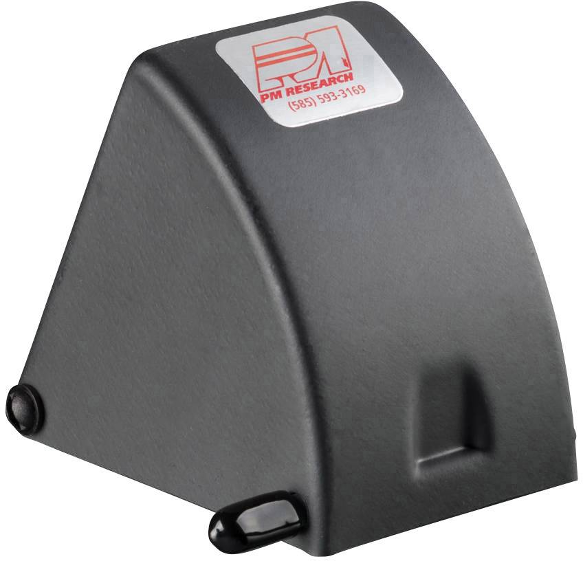 Szary klin z logo firmy 'PM Research' na górnej powierzchni, informacje kontaktowe pod logotypem. Prawdopodobnie stabilizuje lub zabezpiecza obiekty.