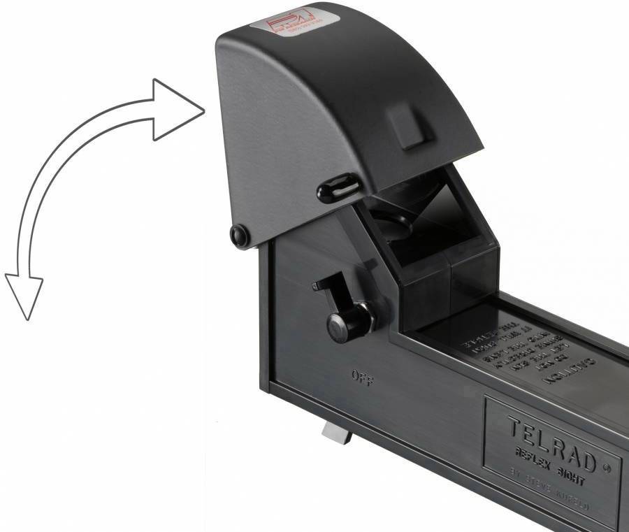 Czarny celownik Telrad z odchylaną pokrywą. Strzałka po lewej stronie wskazuje mechanizm odchylania. Odpowiedni do zastosowań astronomicznych.