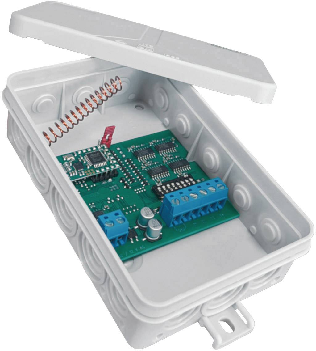 Otwarte, szare plastikowe pudełko z zieloną płytką drukowaną i elementami elektronicznymi w środku, gotowe do technicznej instalacji.