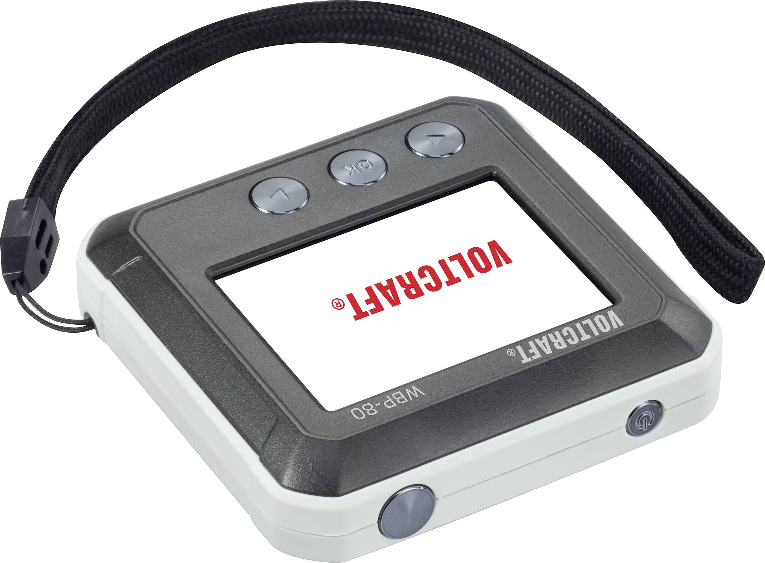 Elektroniczne urządzenie z ekranem, trzema przyciskami i paskiem mocującym. Na ekranie widnieje marka 'VOLTCARF'.