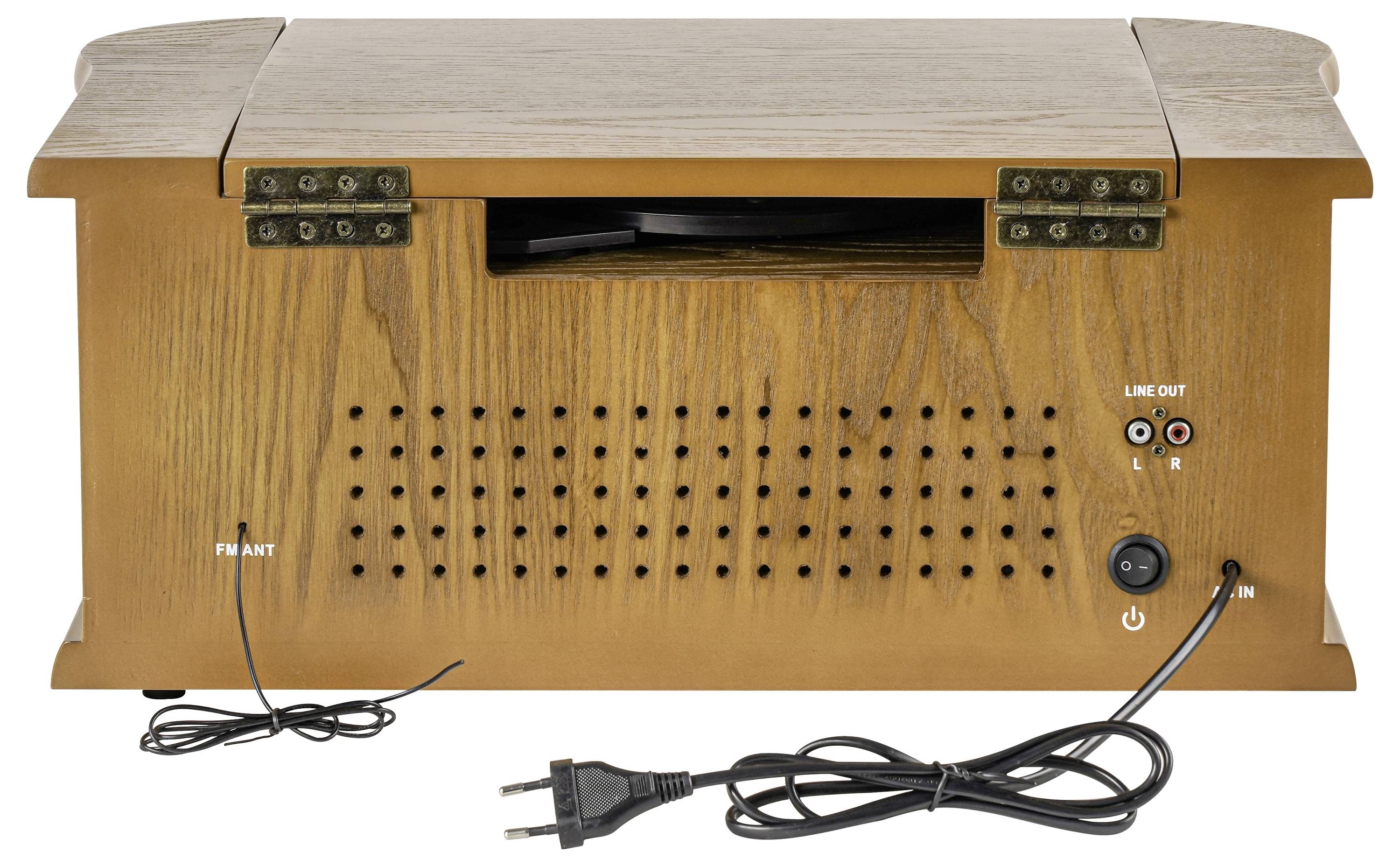 Przenośne radio lub głośnik w stylu drewna z przednią kratką, przyciskiem zasilania, anteną FM, gniazdkami wyjściowymi i dołączonym kablem zasilającym.