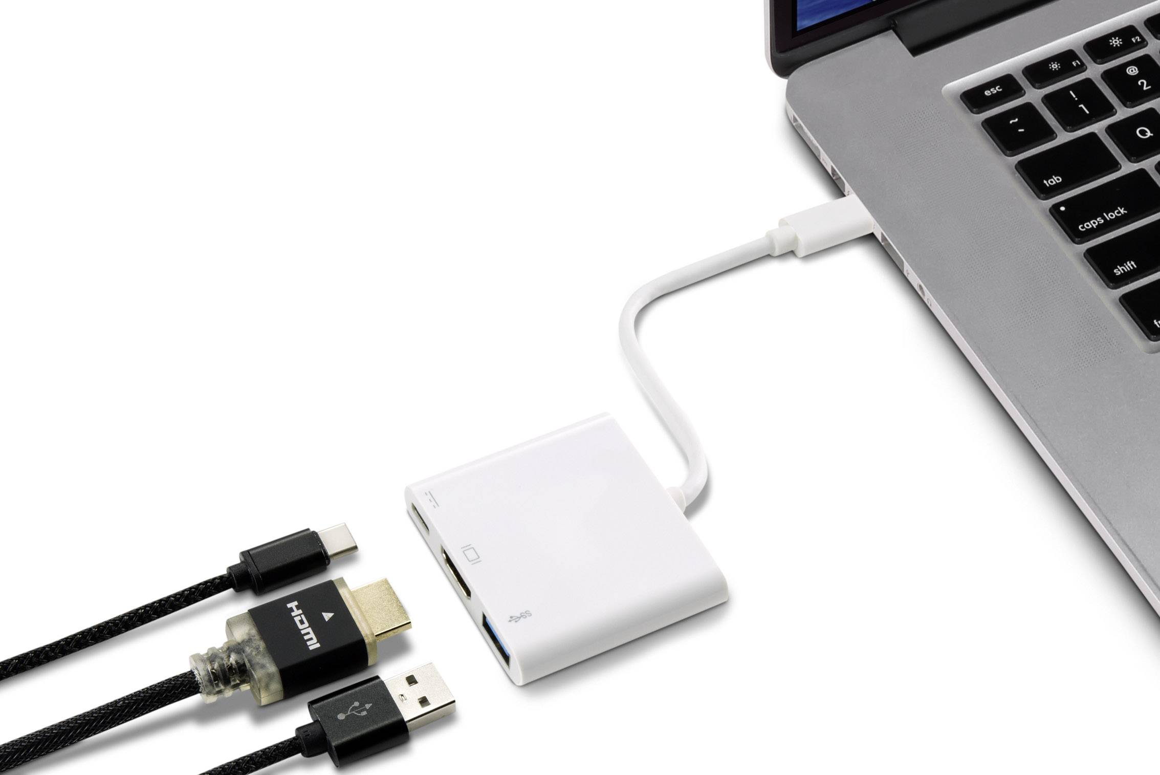 Laptop jest podłączony przez adapter za pomocą trzech kabli: HDMI, USB i zasilającego. Adapter leży obok laptopa.
