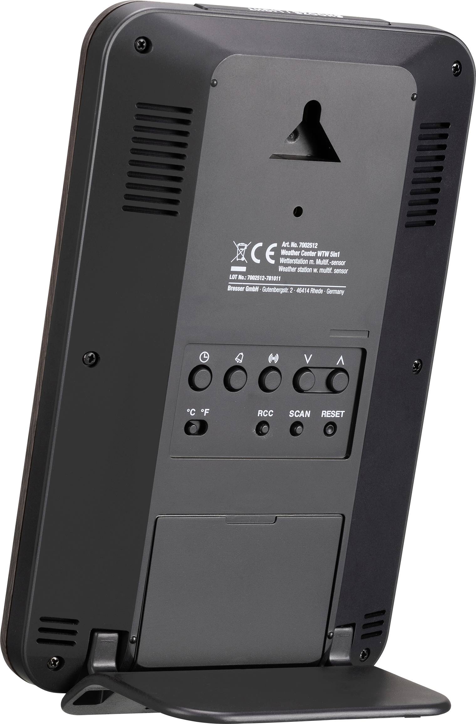 Tylna strona urządzenia elektronicznego z elementami sterującymi i oznaczeniami. Zawiera znak CE i różne pokrętła regulacyjne.