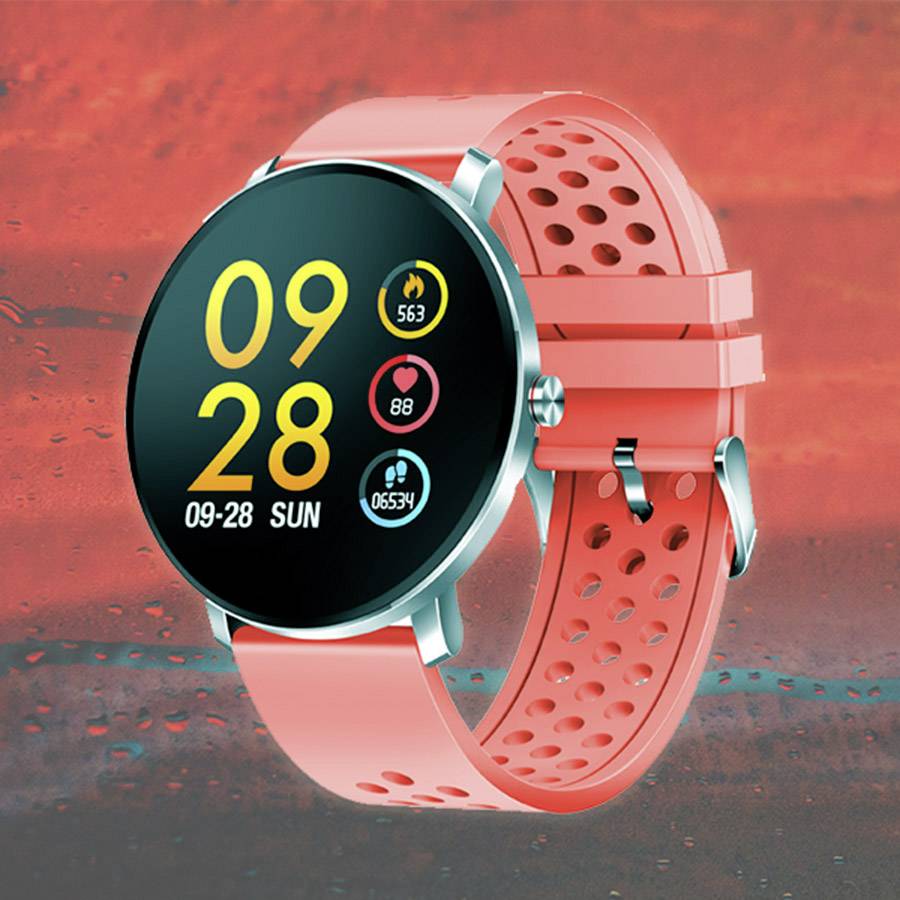 Smartwatch z okrągłym ekranem wyświetla datę i godzinę '09:28, Nd 28.09.' oraz symbole tętna, liczby kroków i poziomu baterii. Koperta i pasek są czerwone.