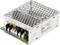 Prostokątny, metalowy moduł zasilacza z perforowaną obudową i kilkoma złączami z przodu. Etykieta tekstowa przedstawia specyfikacje techniczne.