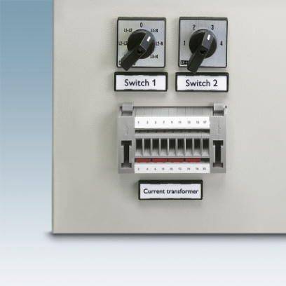 Urządzenie sterujące z dwoma przełącznikami ustawionymi w pozycji 1 oraz transformatorem prądowym poniżej, oznaczonym napisem 'Current transformer'.