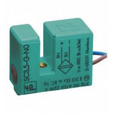 Zielony element elektroniczny z dwoma przewodami przyłączeniowymi, oznaczeniami biegunów plus i minus oraz dodatkowym oznaczeniem technicznym.