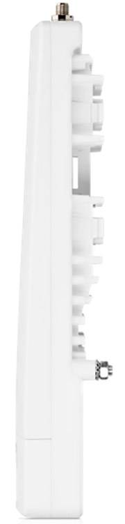 Białe urządzenie elektroniczne widziane z boku; widoczne są złącza i szczegóły strukturalne z tyłu.