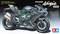 Motocykl Kawasaki Ninja H2 Carbon firmy Tamiya w skali 1:12. Widok z boku ukazuje szczegóły i zielony akcentowany rama.
