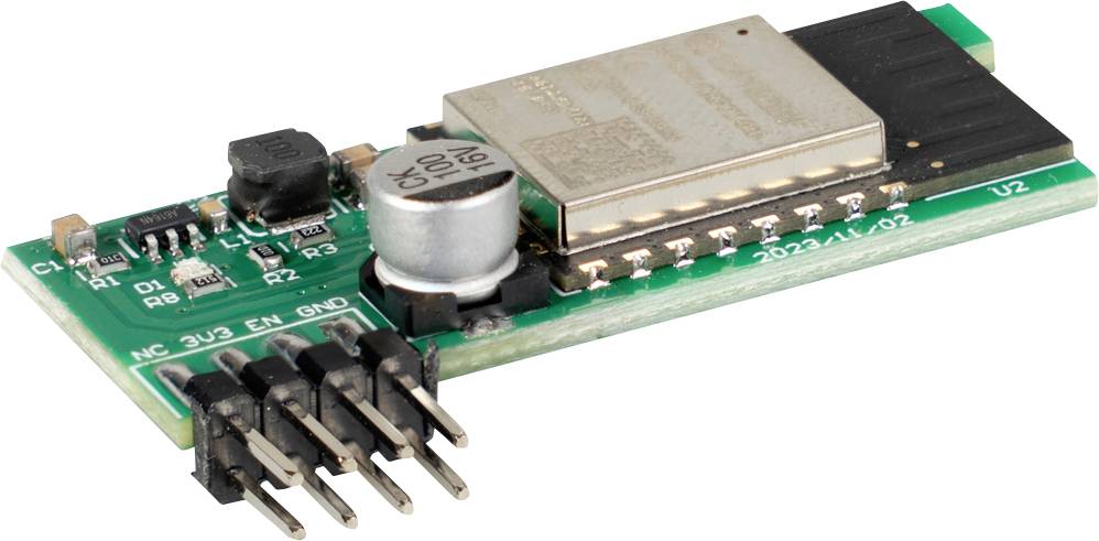Mała elektroniczna płytka drukowana z metalowym obudowanym modułem, kondensatorem, cewką indukcyjną i złączami żeńskimi na białym tle.