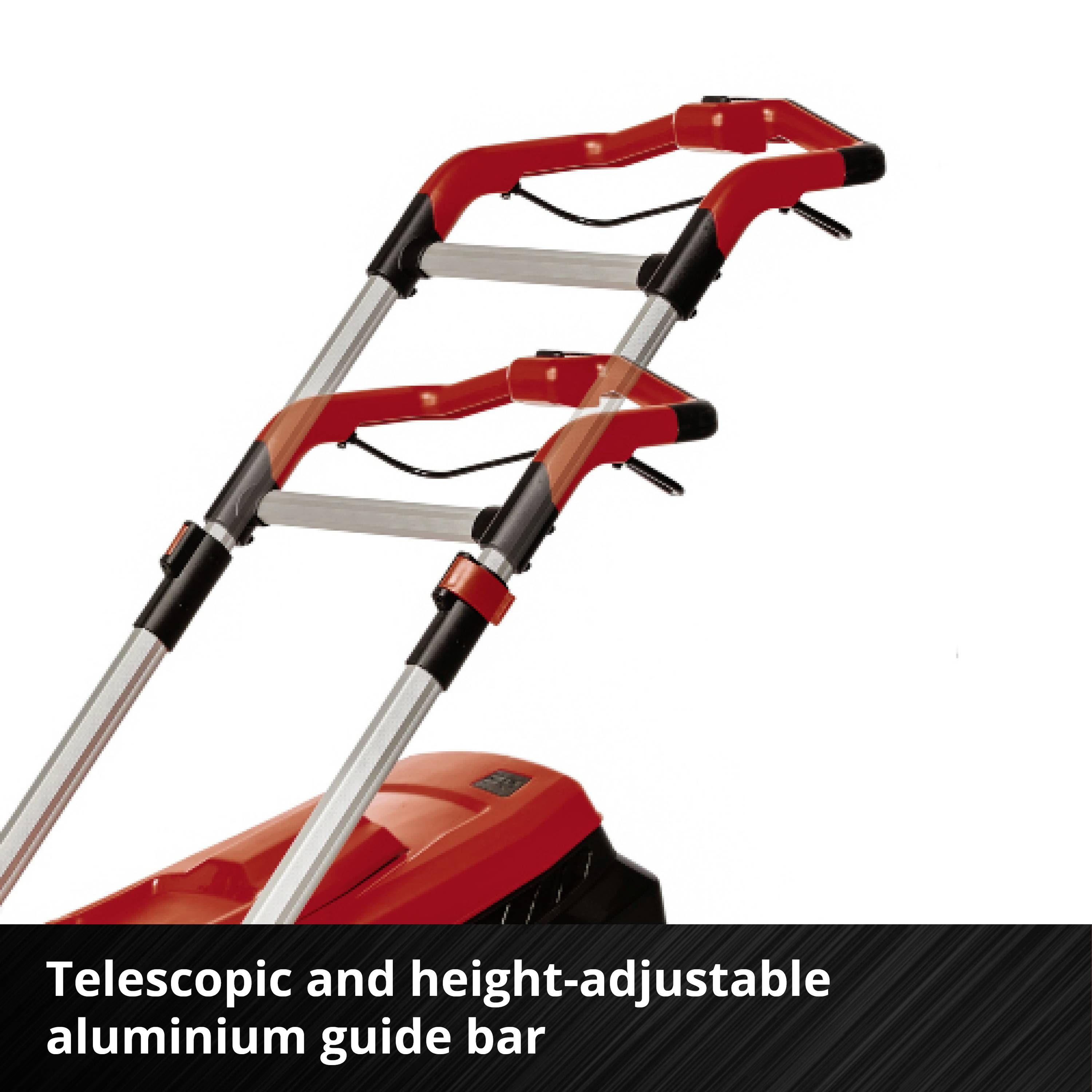 Teleskopowy i regulowany na wysokość aluminiowy pręt prowadzący z dwoma czerwonymi uchwytami na urządzeniu.