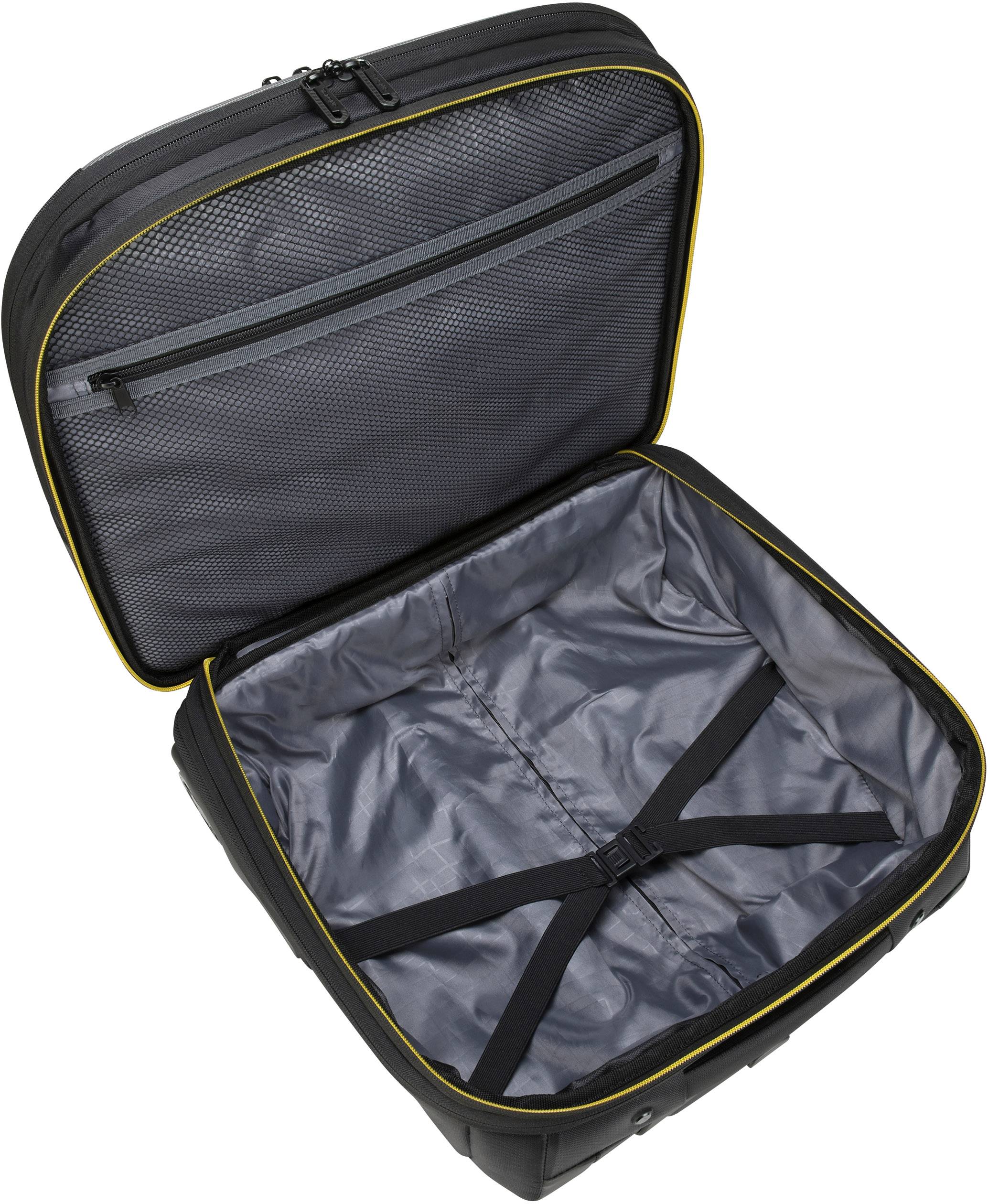 Otwarty kufer z dużą główną komorą, paskami napinającymi do zabezpieczenia zawartości oraz siateczkową kieszenią w pokrywie.