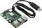 Zielona płytka Raspberry Pi z wieloma portami USB i portem Ethernet, podłączona czarnym kablem USB.