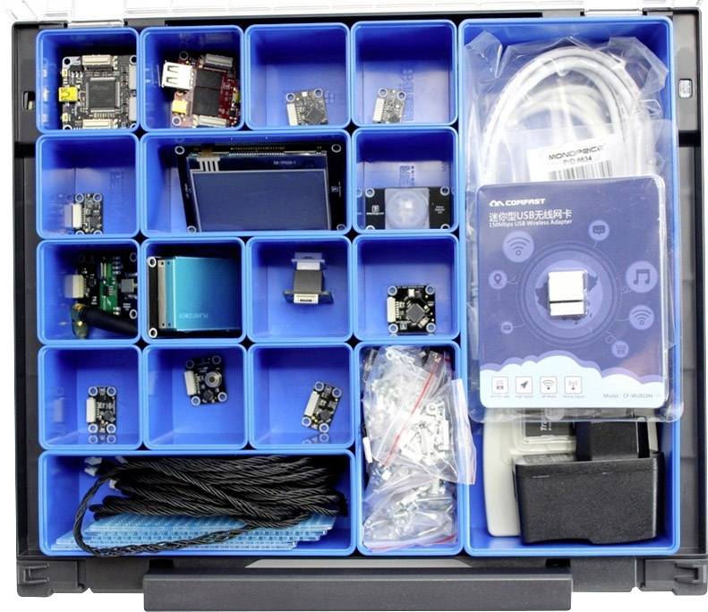 Zestawy elektroniczne z różnymi modułami i komponentami w organizatorze. Zawiera czujniki, przewody i wyświetlacze LED.