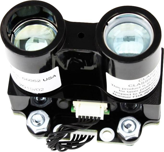 Zbliżenie obrazu czujnika optycznego z dwoma soczewkami. Obok niego znajdują się przewody i techniczne opisy na etykietach.