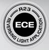 Logo dla 'ECE R23 Reversing Light Application', przedstawiające okrągłą plakietkę z literami 'ECE' pośrodku.
