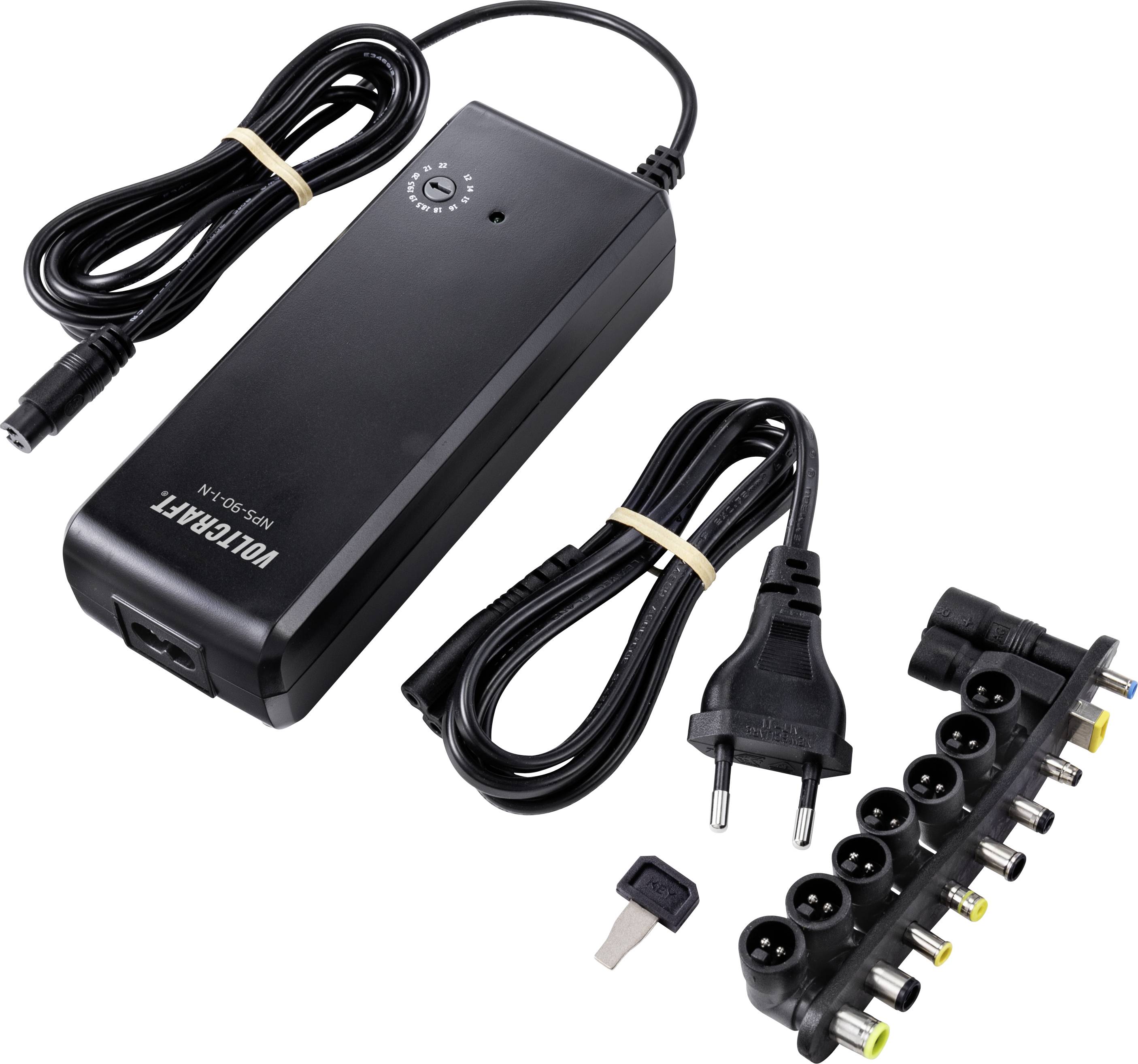 Czarny zasilacz sieciowy z wieloma wymiennymi wtyczkami do regulacji napięcia. Zawiera wtyczkę europejską i regulowany przełącznik napięcia.