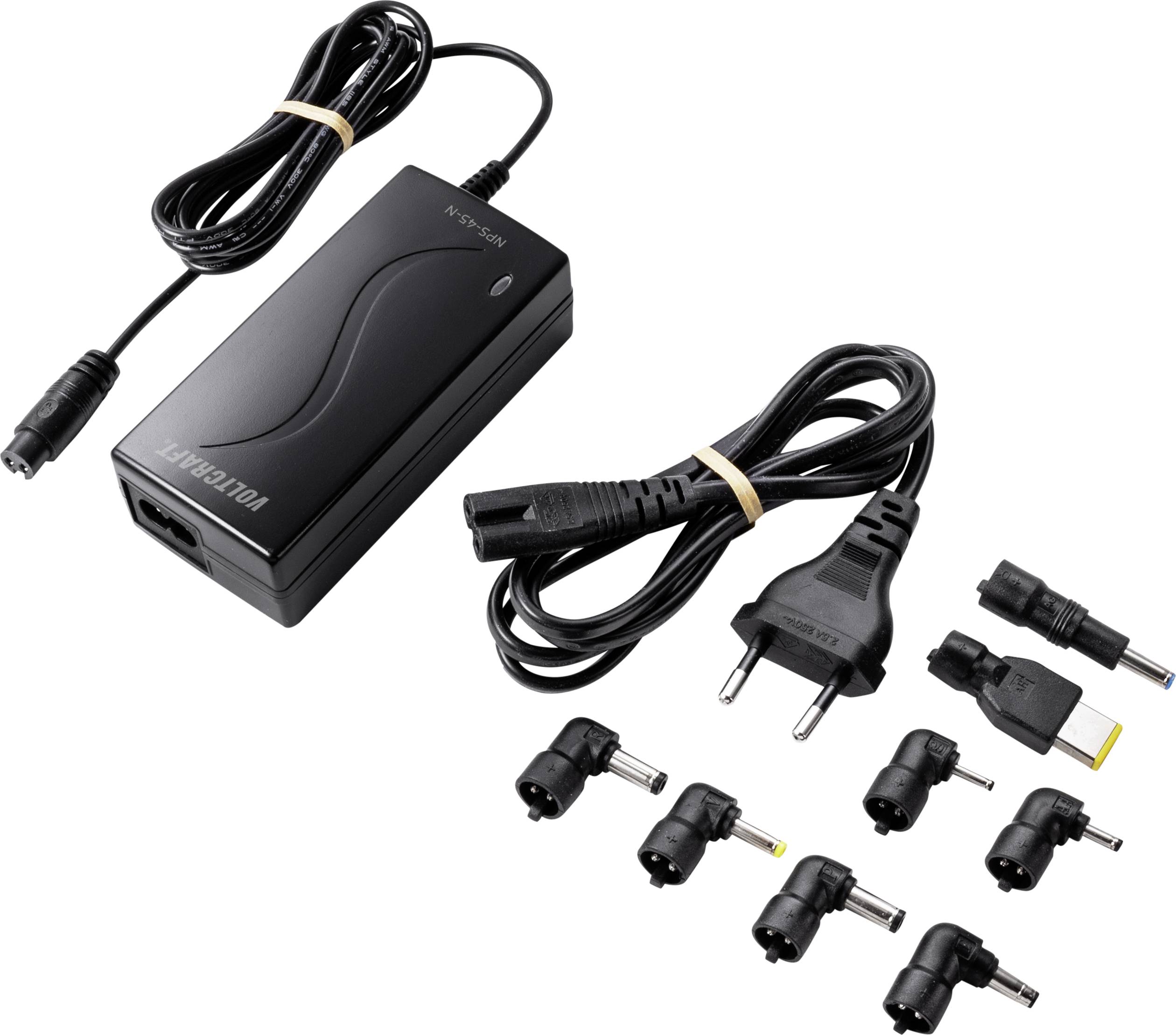 Czarny uniwersalny zasilacz z wieloma adapterami i przewodem sieciowym. Odpowiedni do różnych urządzeń elektronicznych.