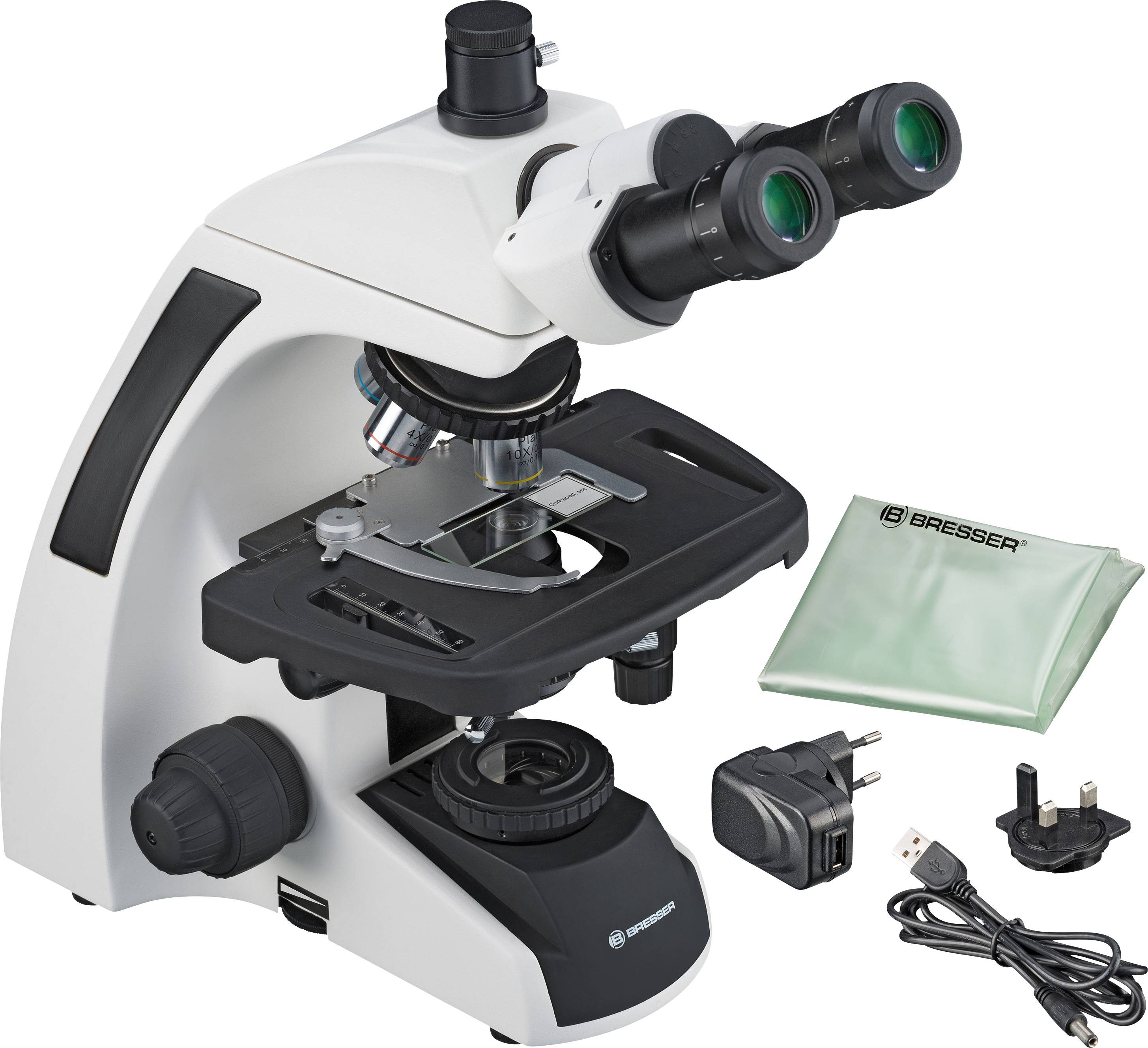 Białoczarny mikroskop z akcesoriami, takimi jak obiektywy, przewód zasilający i adapter. Nadaje się do badań naukowych.