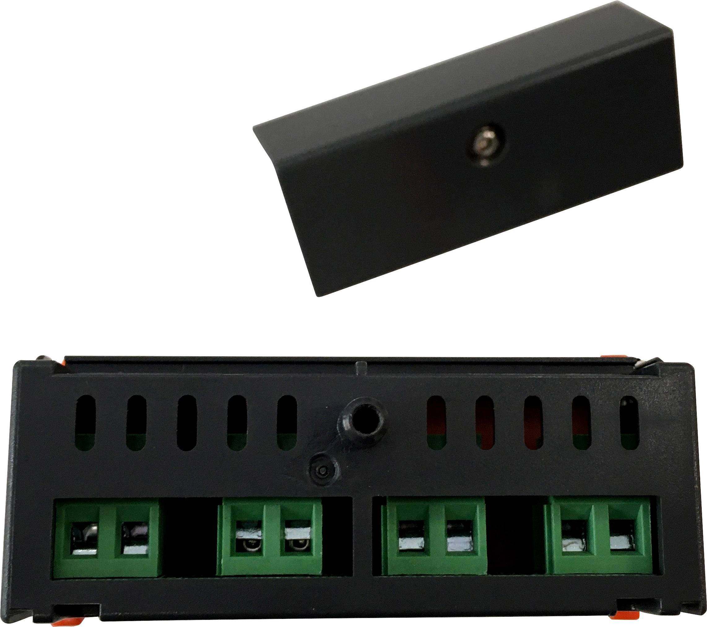 Czarny elektryczny element wyposażony w kilka zielonych zacisków przyłączeniowych z możliwością zdjęcia pokrywy, służący do łączenia przewodów i ich zabezpieczania.