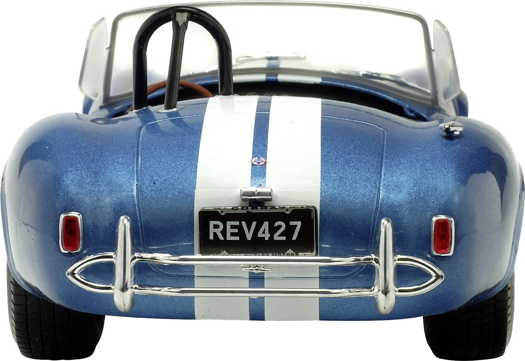 Niebieskie cabrio widziane od tyłu z białymi paskami i tablicą rejestracyjną 'REV427'. Czyste linie i błyszcząca karoseria, sportowy design.