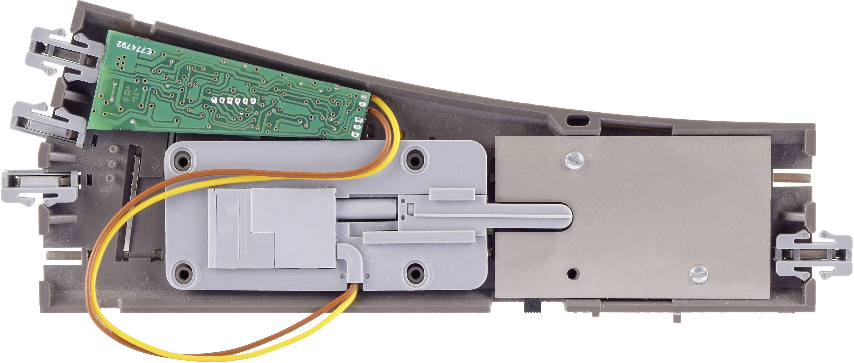 Elektroniczny obwód z płytką drukowaną i okablowaniem, zamontowany na szarej podstawce z tworzywa sztucznego.