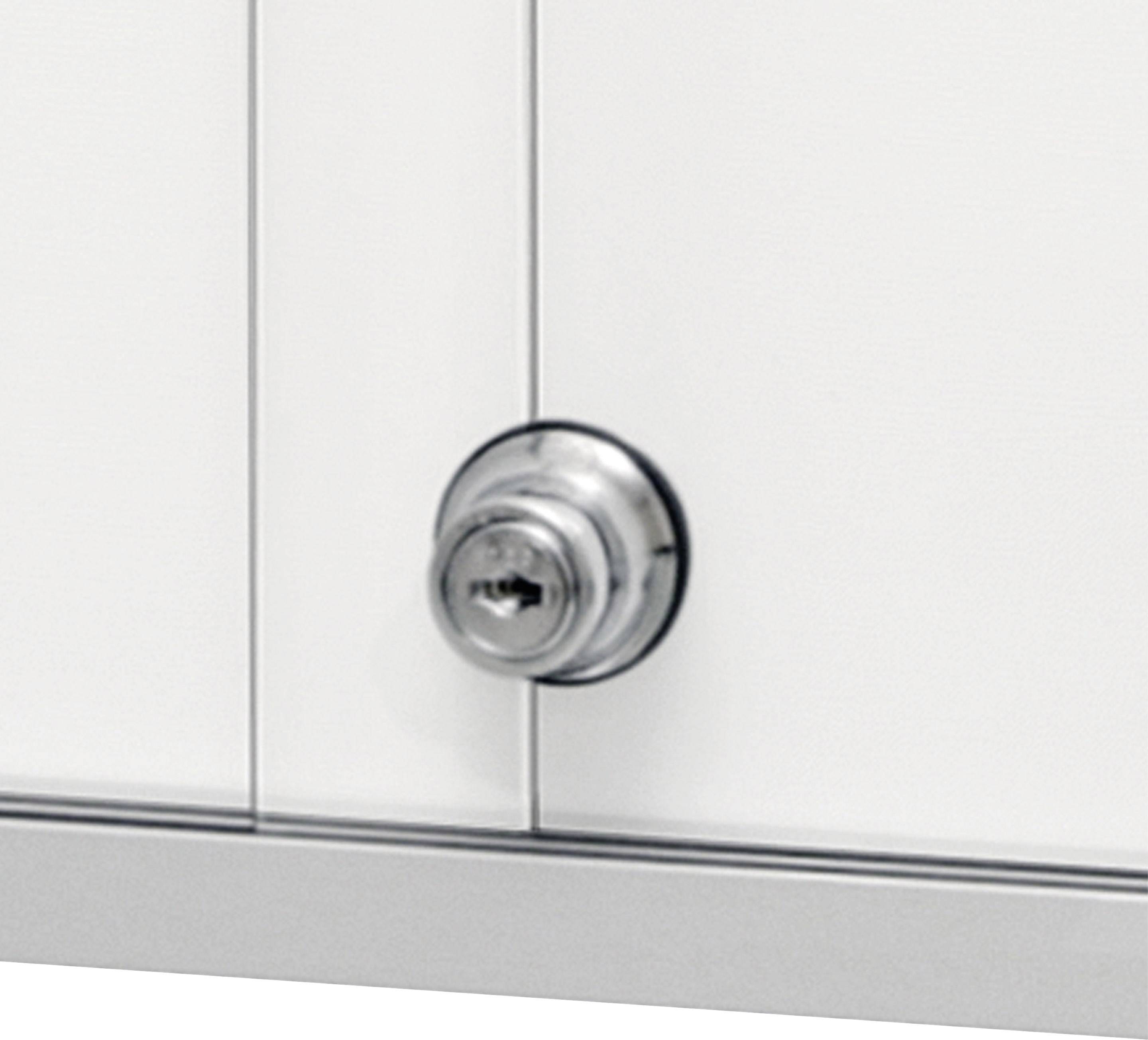 Metalowe drzwi z okrągłą, srebrną klamką.