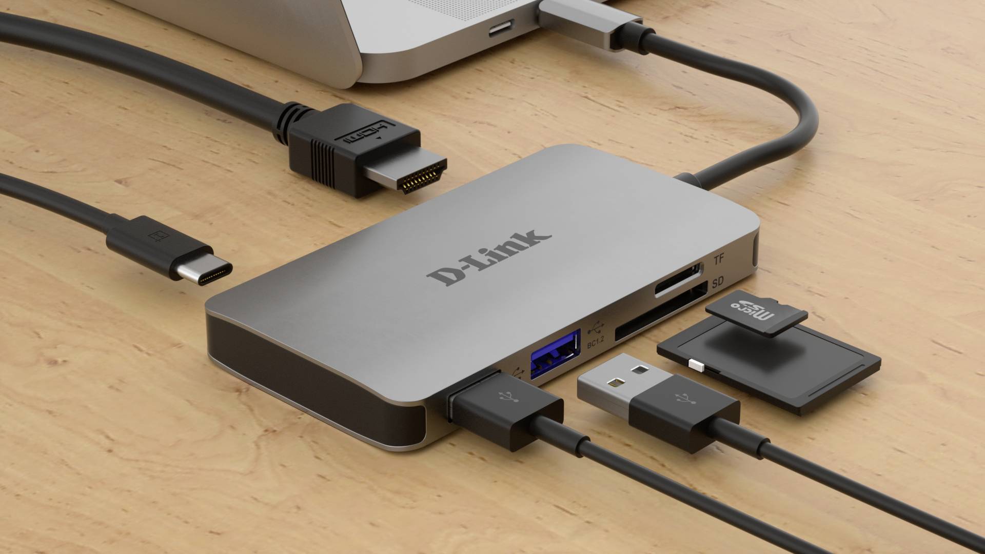 Hub USB-C z wieloma portami, w tym USB-A, Ethernet, HDMI i czytnikiem kart SD. Podłączony do laptopa.