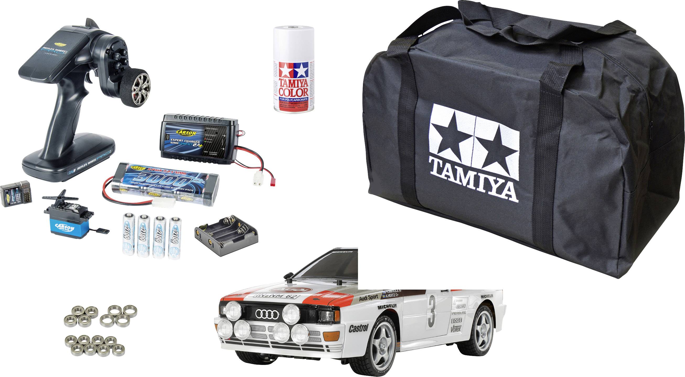 Zestaw zdalnie sterowanego samochodu obejmujący samochód, pilot zdalnego sterowania, baterie, torbę transportową i akcesoria. Idealny dla pasjonatów modelarstwa.