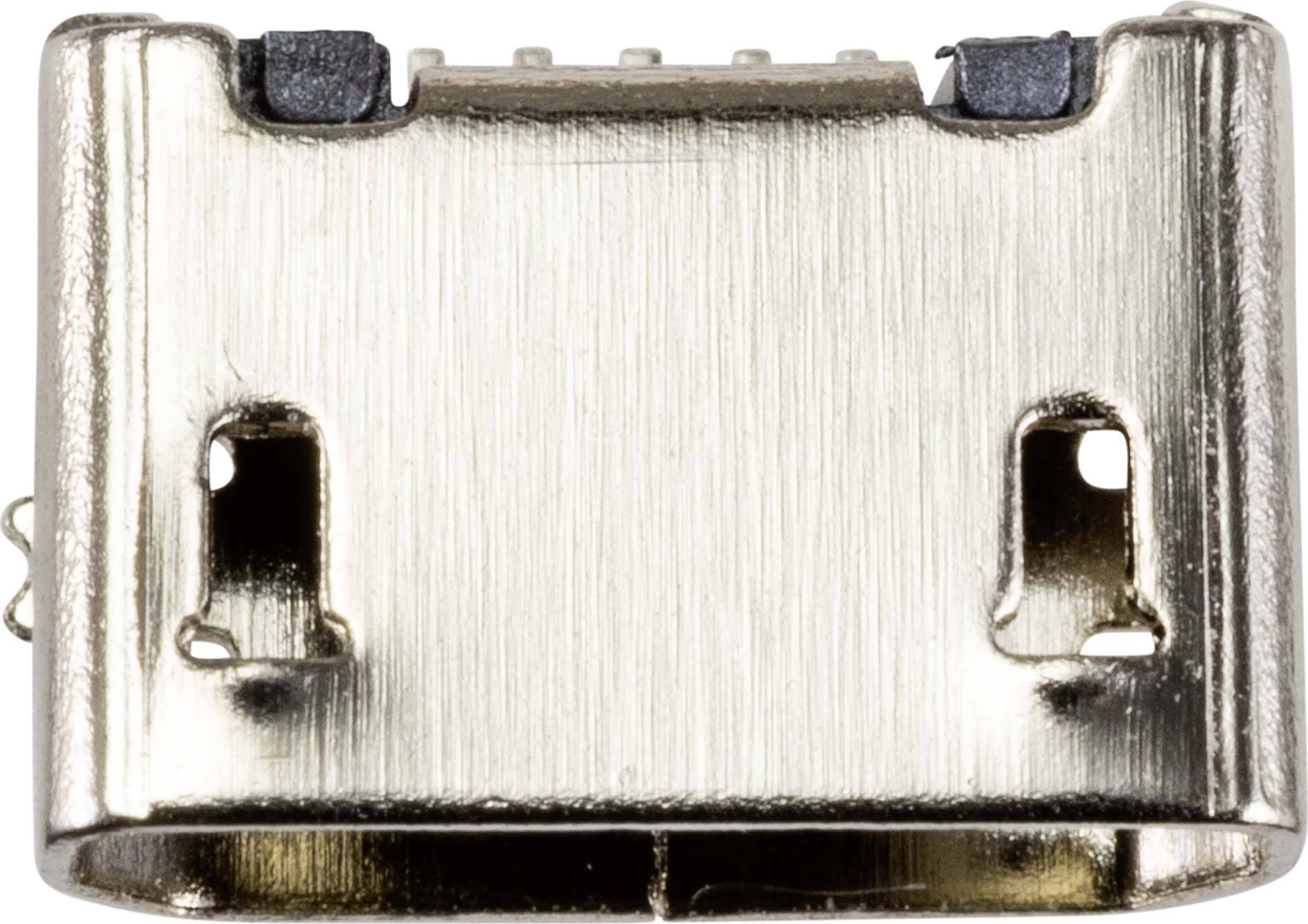 Zbliżenie złącza micro-USB. Widoczne są metalowe styki wewnątrz. Złącze nadaje się do lutowania na płytkę drukowaną.