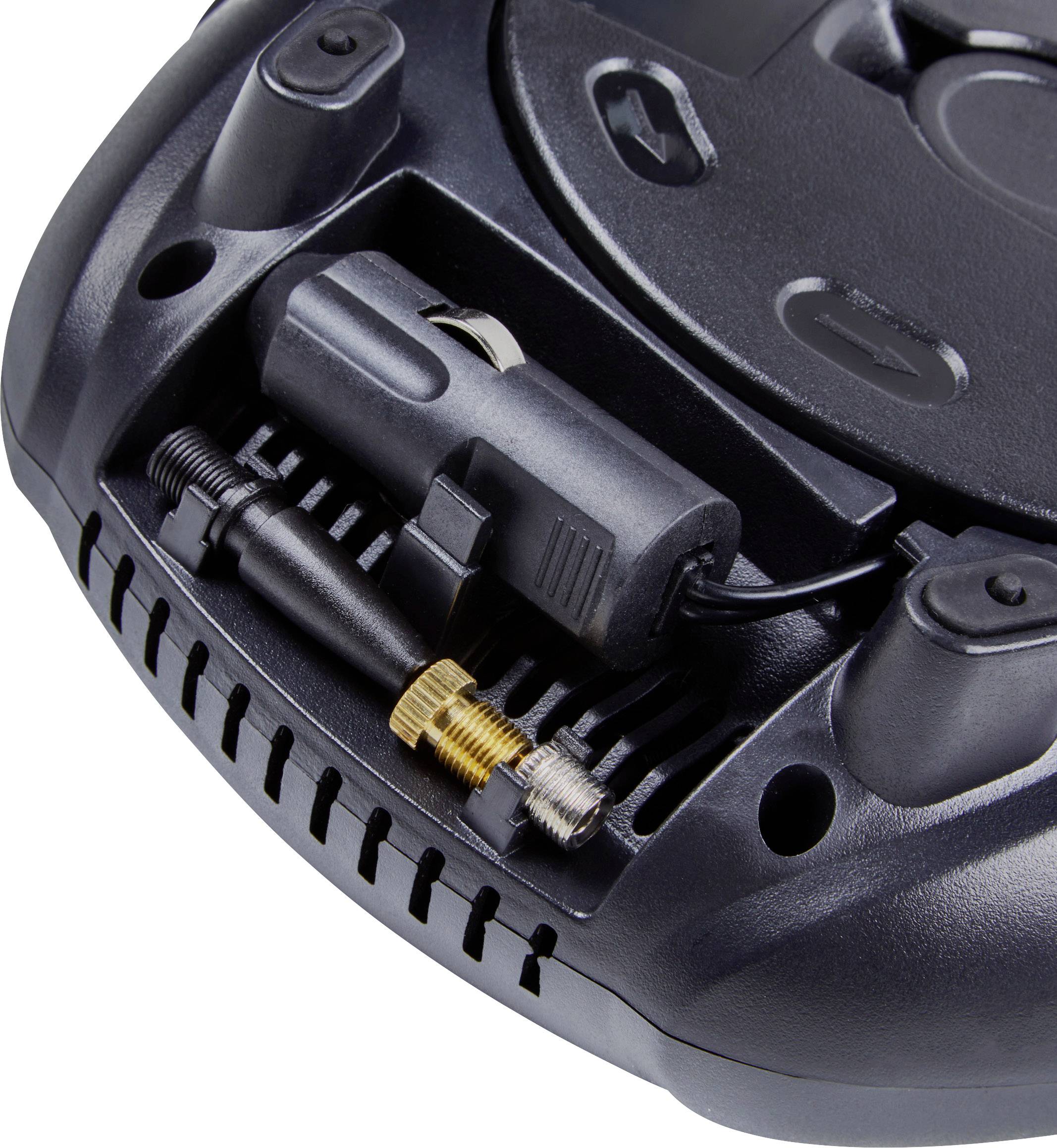 Zbliżenie czarnego urządzenia elektronicznego z widocznym złączem i przewodem.