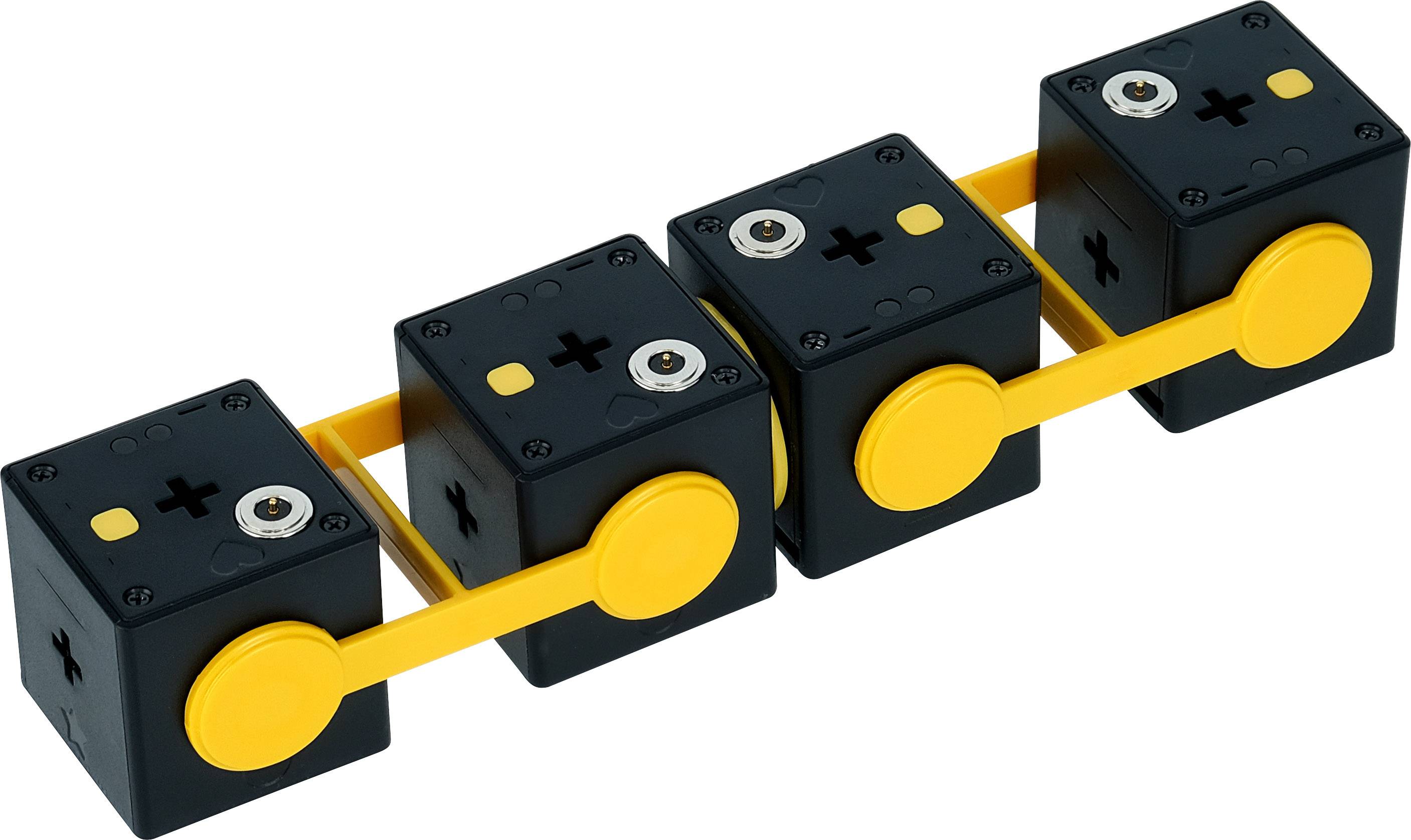 Cztery czarne sześciany połączone żółtymi prętami, z żółtymi pokrętłami po bokach.