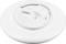Białe, okrągłe mocowanie ścienne lub sufitowe przeznaczone do zamontowania urządzenia elektronicznego. Widoczne jest jego wnętrze z elementem mocującym.