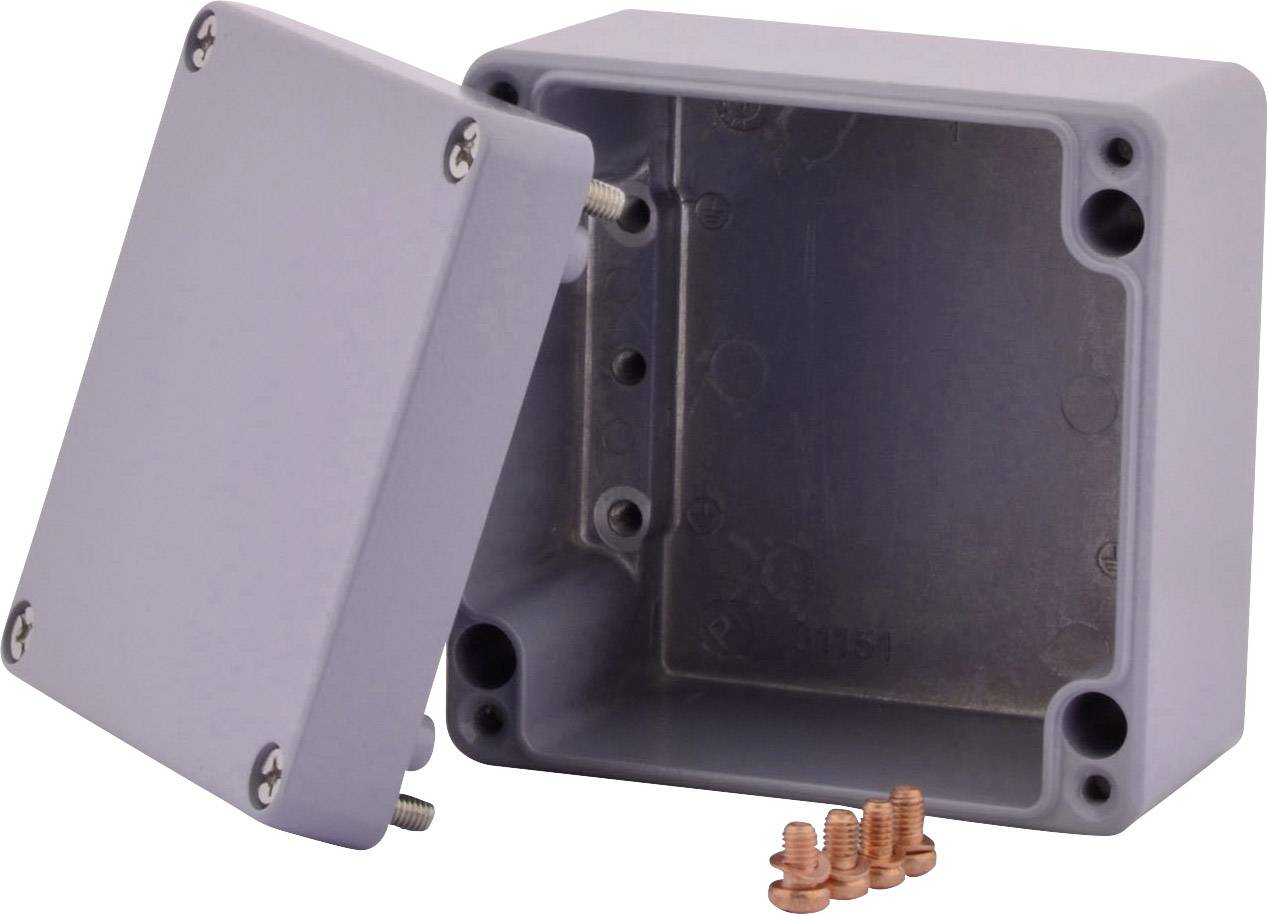 Szaro-biała, prostokątna puszka przyłączeniowa z tworzywa sztucznego z zdejmowaną pokrywą, czterema otworami do montażu naściennego oraz czterema miedzianymi wkrętami.