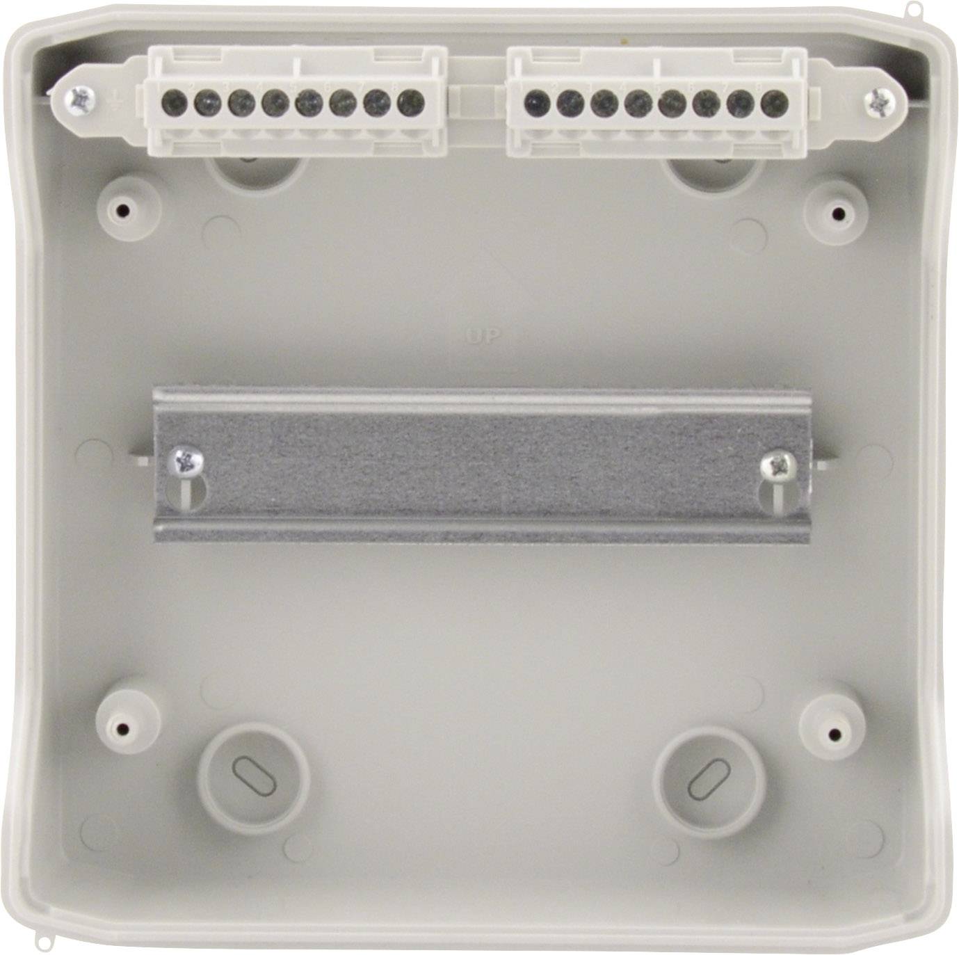 Pusta obudowa do podłączeń elektrycznych, z listwą zaciskową u góry i szyną montażową pośrodku.