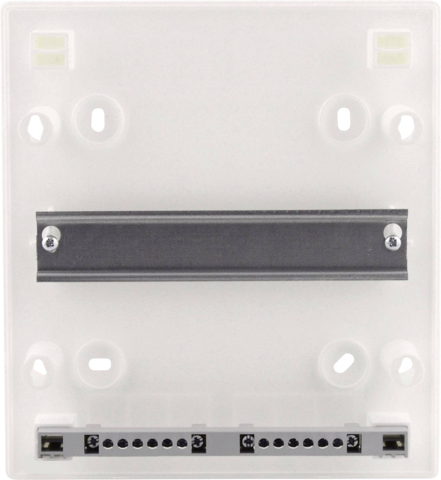 Tylna strona urządzenia elektrycznego z zaciskami przyłączeniowymi i szyną montażową.