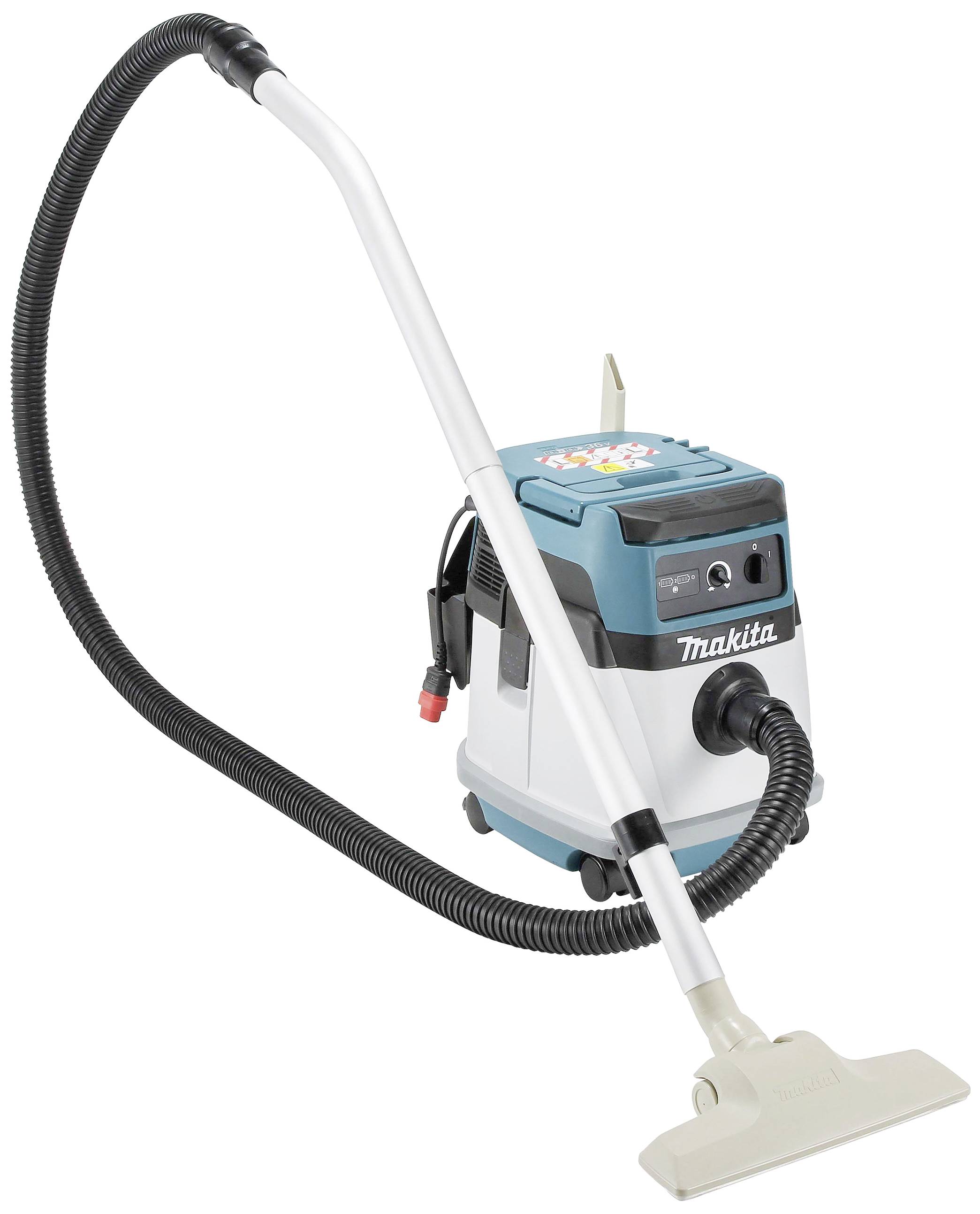 Przemysłowy odkurzacz z długim, czarnym przewodem przedłużającym i białą rączką. Na urządzeniu widnieje napis 'Makita'. Odpowiedni do użytku na placach budowy.