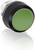 Okrągły zielony przycisk z czarną obramówką; prawdopodobnie przełącznik lub guzik w urządzeniu technicznym.