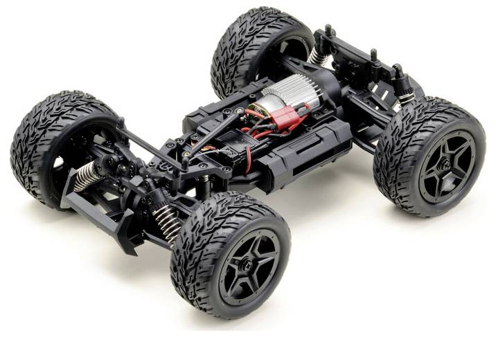 Szczegółowy widok podwozia samochodu sterowanego zdalnie przedstawiający odsłonięty silnik, okablowanie i system zawieszenia z solidnymi oponami terenowymi.
