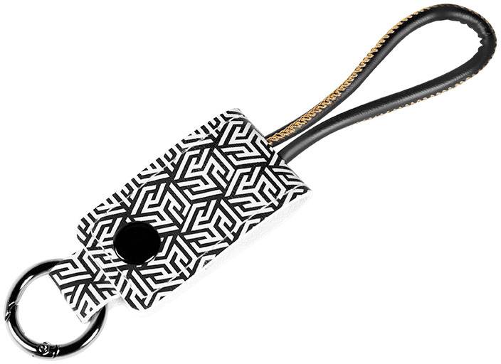 Brelok z geometrycznym wzorem, obejmujący pierścień na klucze i czarną pętelkę.