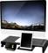 Monitor komputerowy z krajobrazem w tle, otoczony tabletem i smartfonem, stojącymi na czarnym wsporniku.